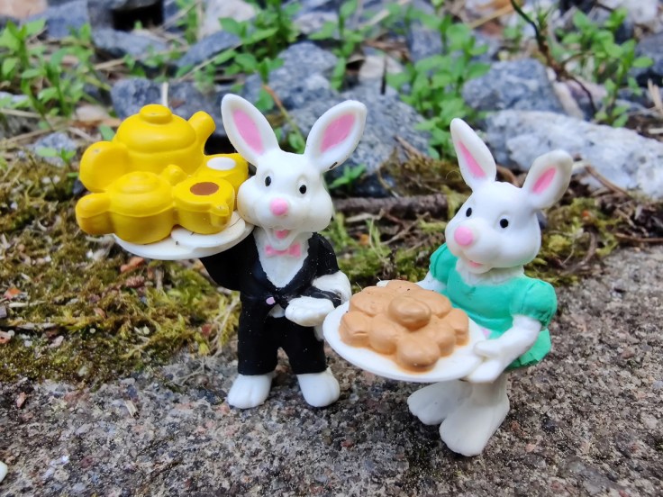 Two plastic toy bunnies.