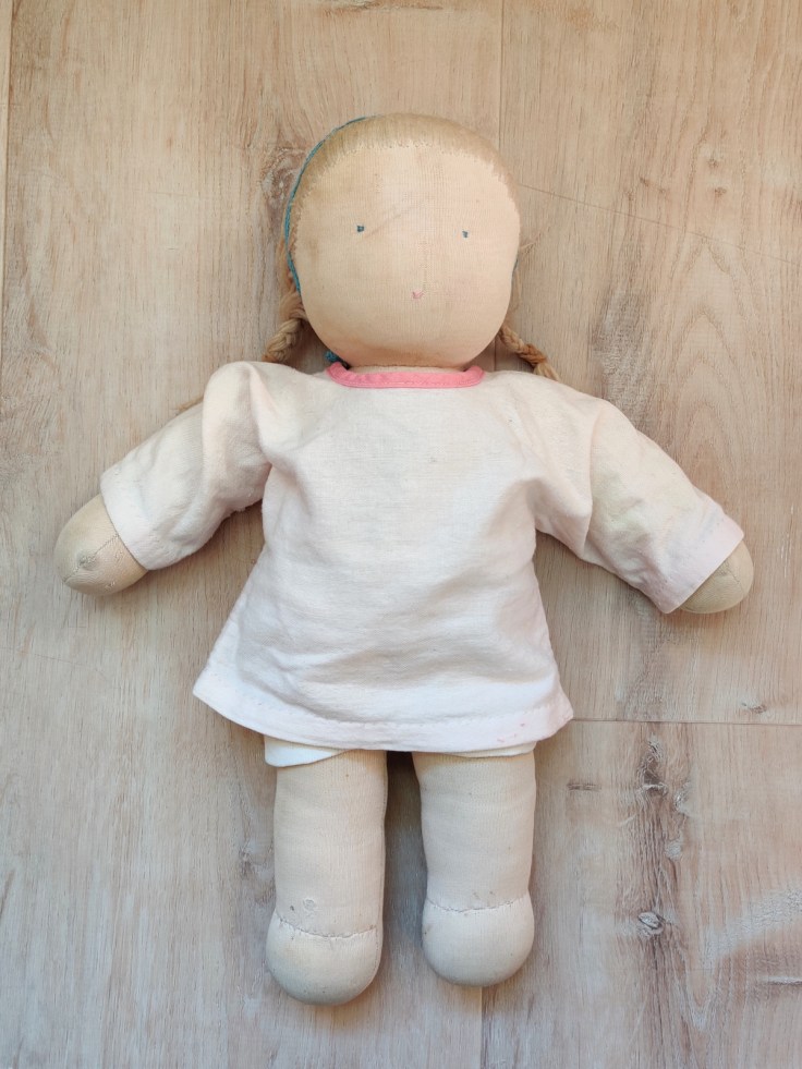 A light-haired Steiner doll / Waldorf doll from 1987 in its original clothes.